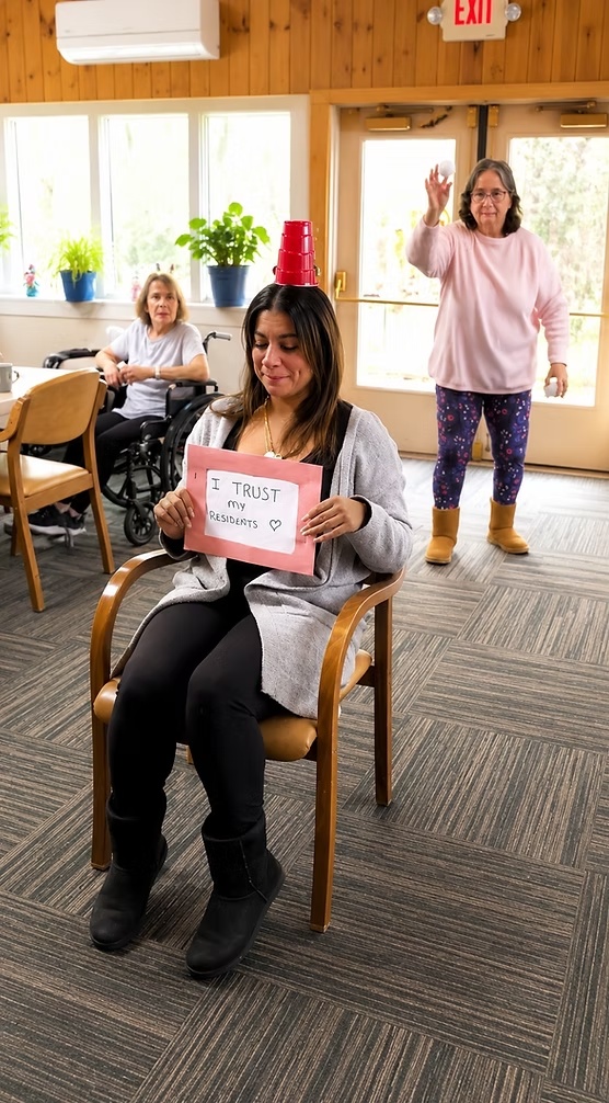 Residents and staff enjoying an activity at Ethan Place